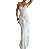Evening dress with a long skirt that cinches at the waist to show off a slender figure