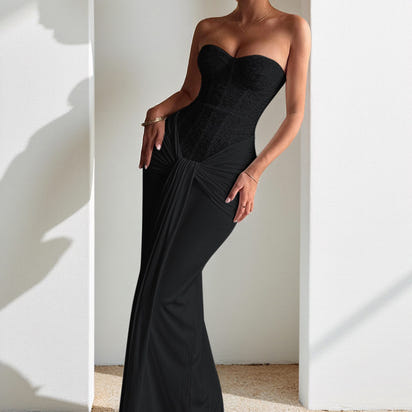 Evening dress with a long skirt that cinches at the waist to show off a slender figure