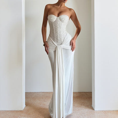 Evening dress with a long skirt that cinches at the waist to show off a slender figure