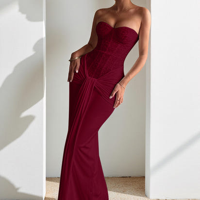 Evening dress with a long skirt that cinches at the waist to show off a slender figure