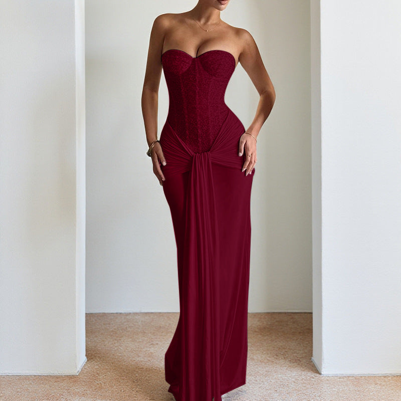 Evening dress with a long skirt that cinches at the waist to show off a slender figure